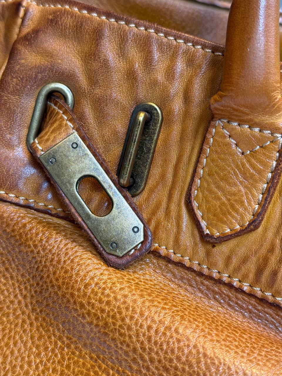 Cognac washed leather bag with handmade finished color