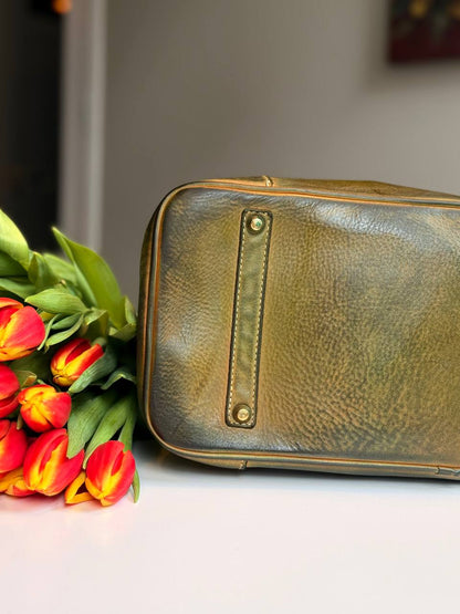 Green washed leather bag with handmade finished color