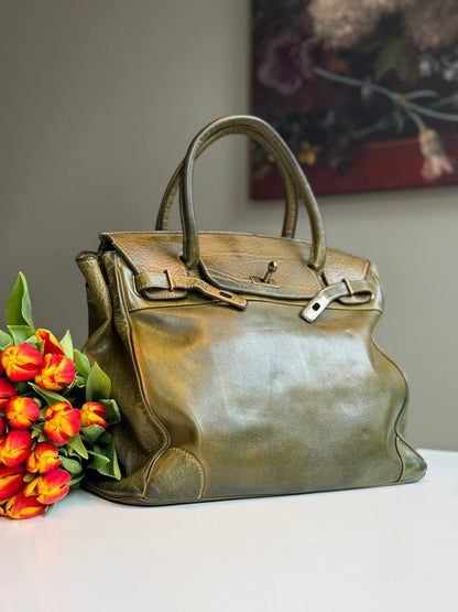 Green washed leather bag with handmade finished color