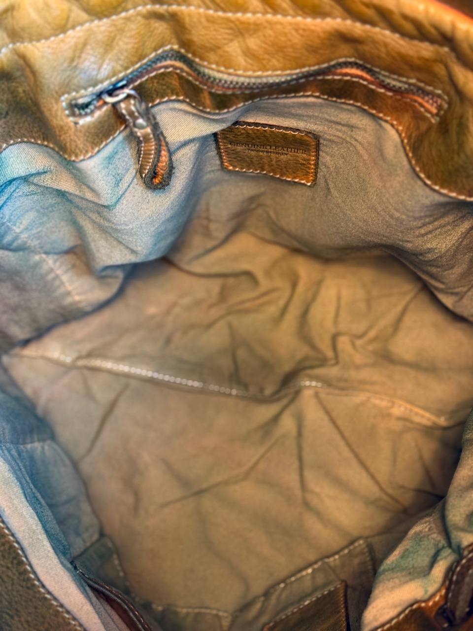 Green washed leather bag with handmade finished color