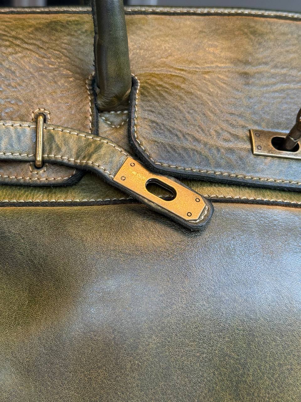 Green washed leather bag with handmade finished color