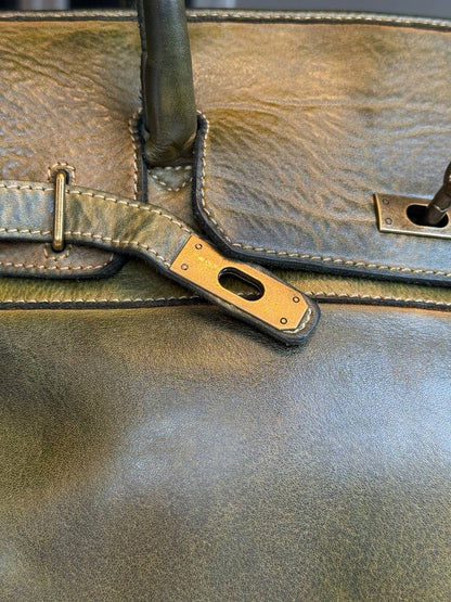 Green washed leather bag with handmade finished color