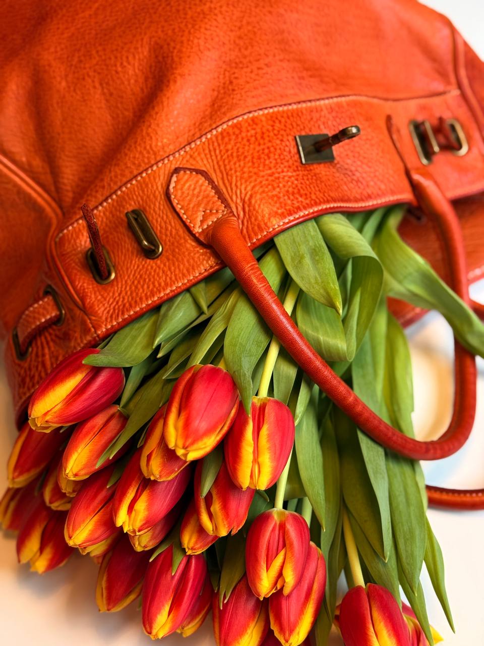 Orange washed leather bag with handmade finished color