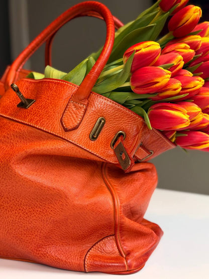 Orange washed leather bag with handmade finished color