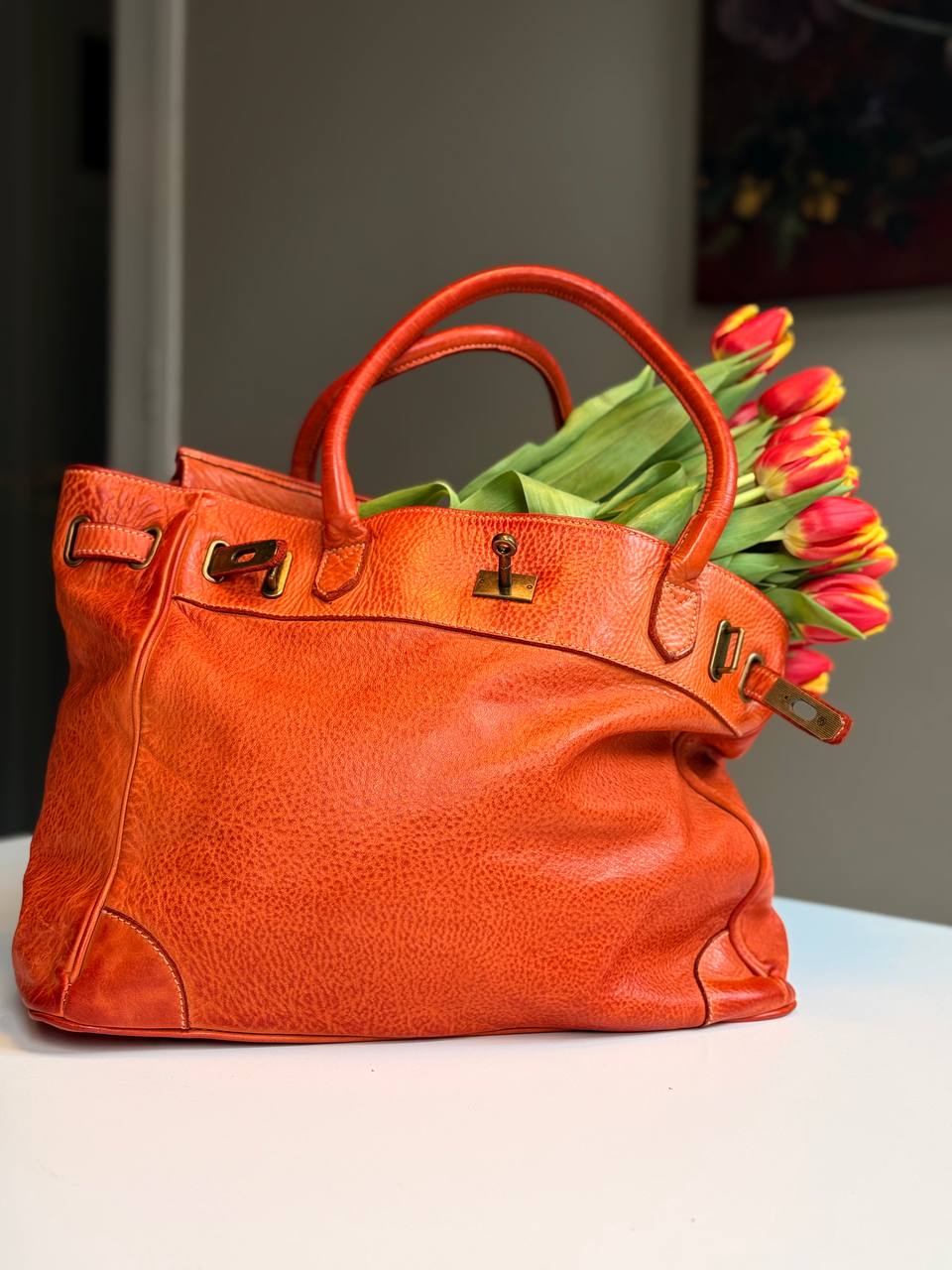 Orange washed leather bag with handmade finished color