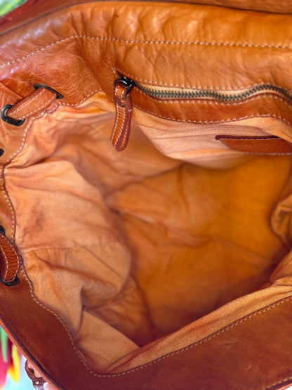 Orange washed leather bag with handmade finished color