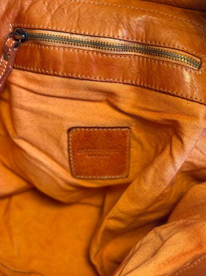 Orange washed leather bag with handmade finished color