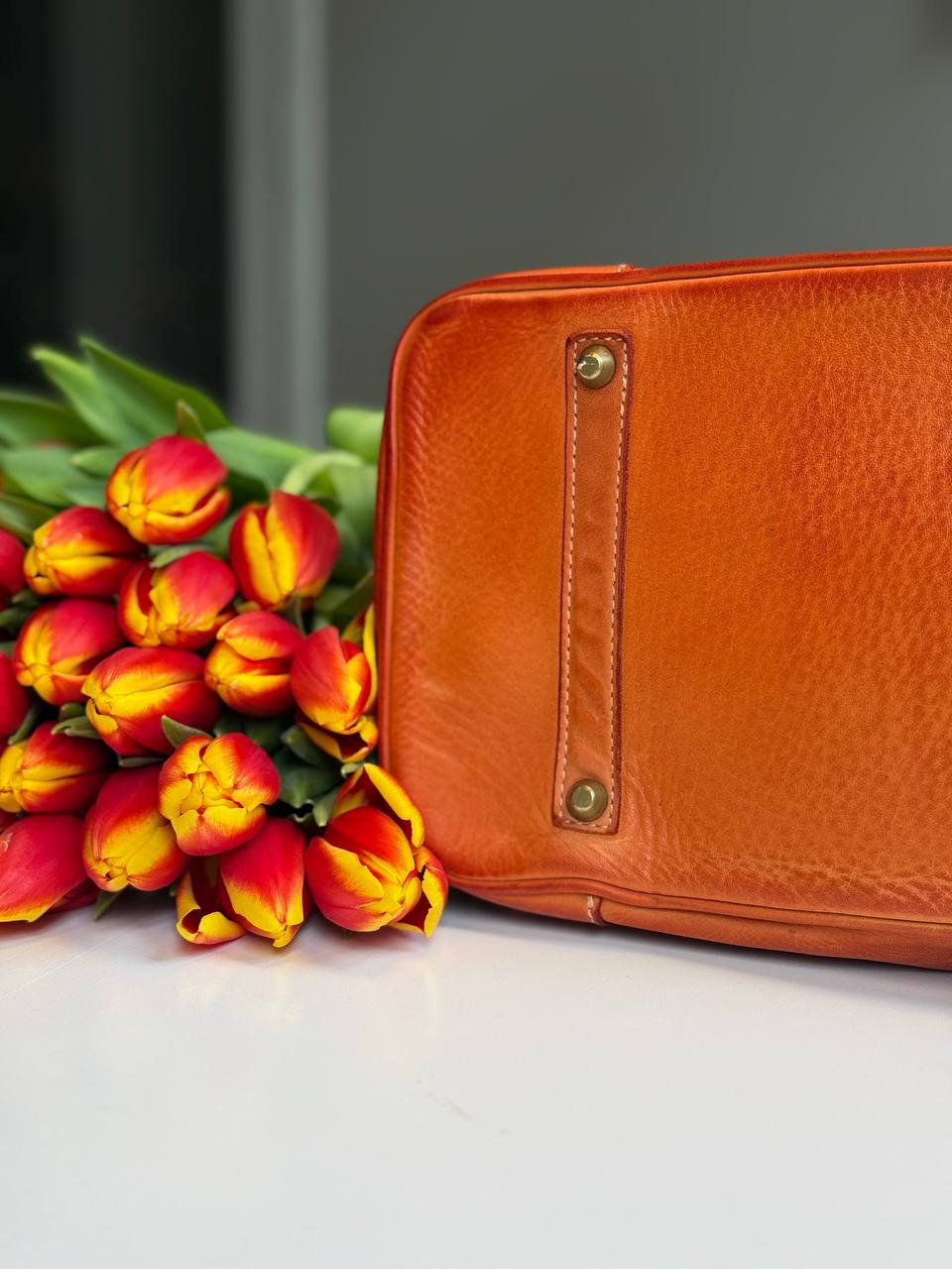 Orange washed leather bag with handmade finished color