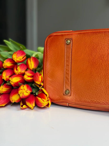 Orange washed leather bag with handmade finished color
