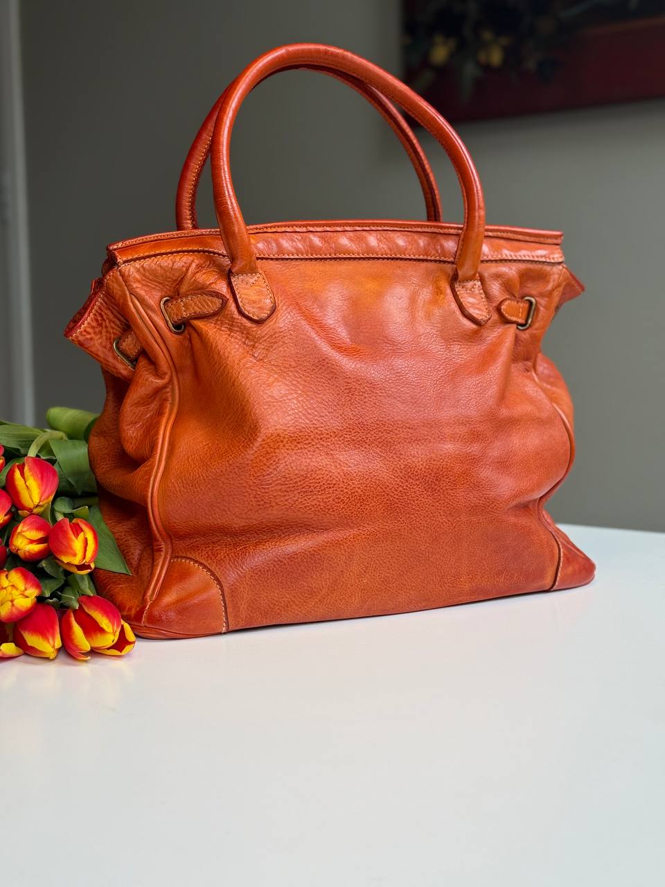 Orange washed leather bag with handmade finished color