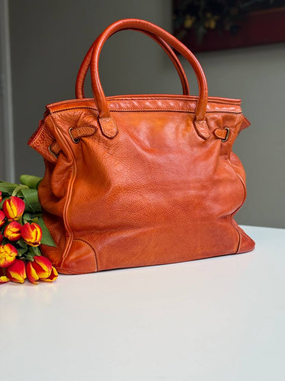 Orange washed leather bag with handmade finished color