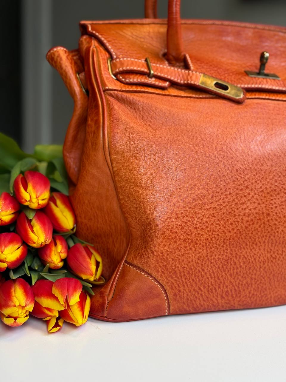 Orange washed leather bag with handmade finished color