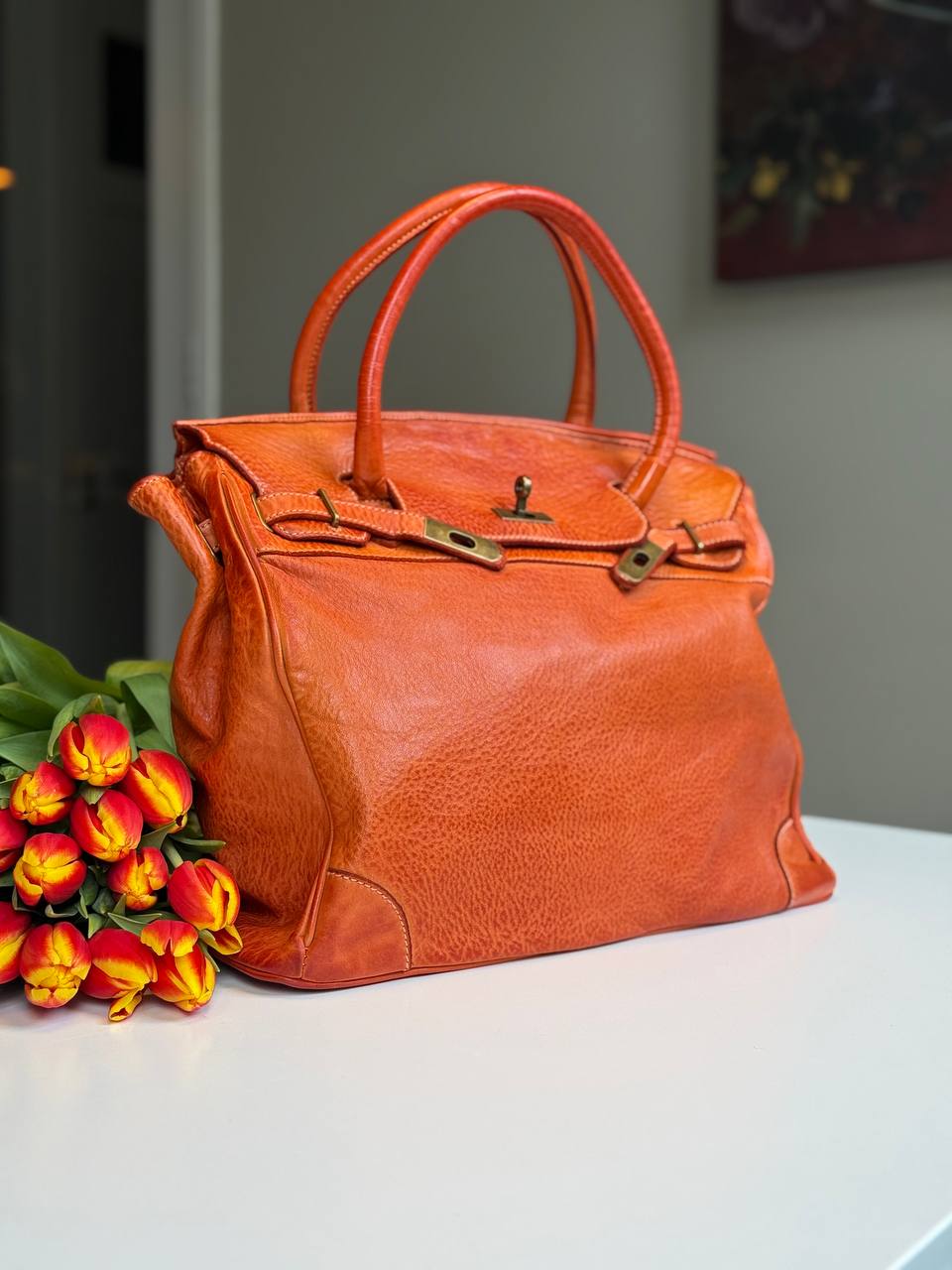 Orange washed leather bag with handmade finished color